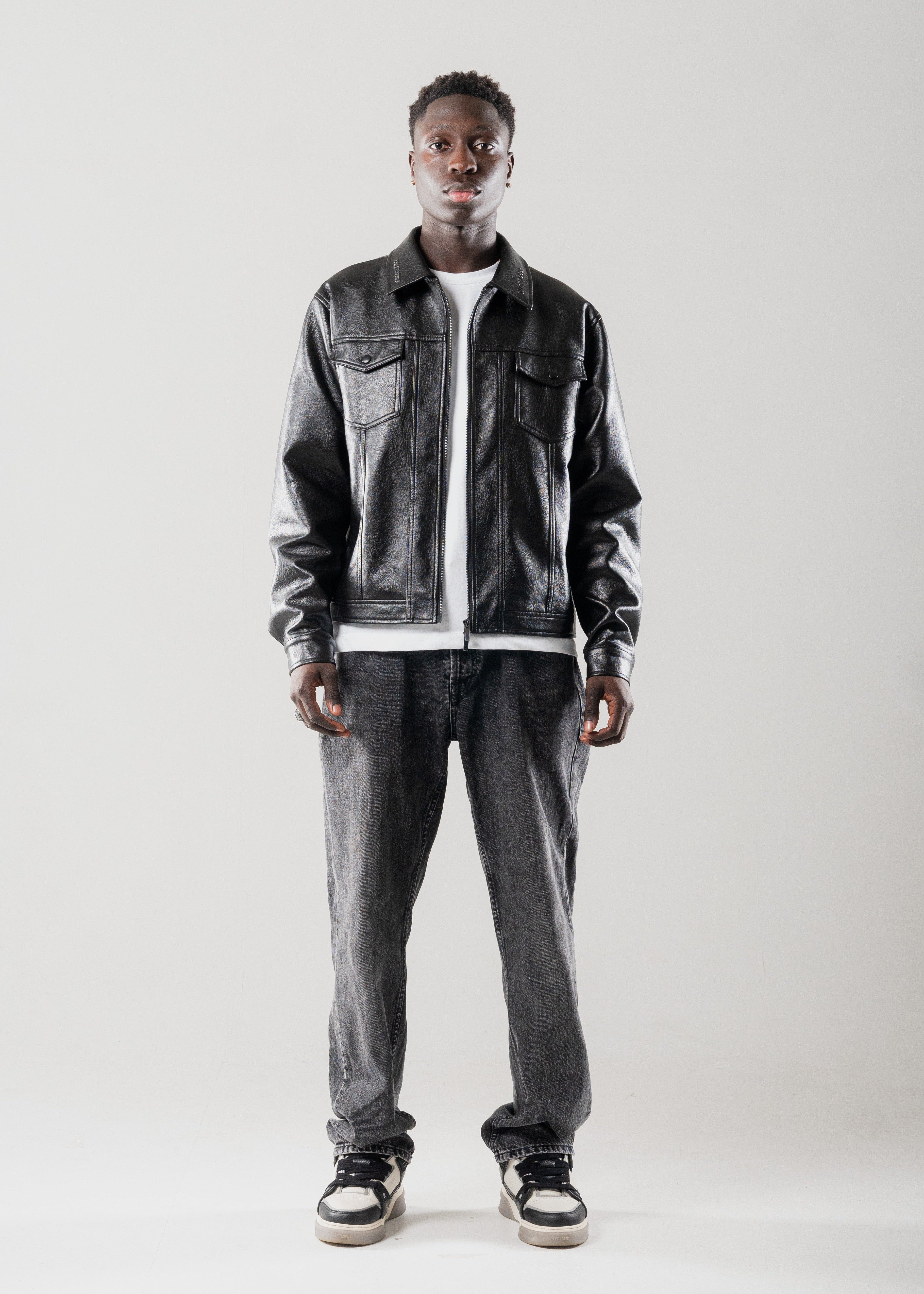 Model wearing Mallacco cropped black leather jacket against neutral backdrop