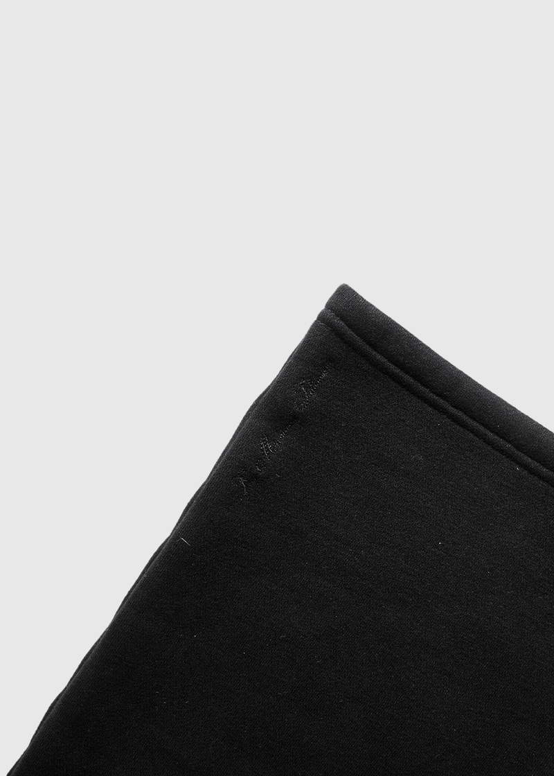 Close-up of Mallacco black jogger fabric and waistband detailing.