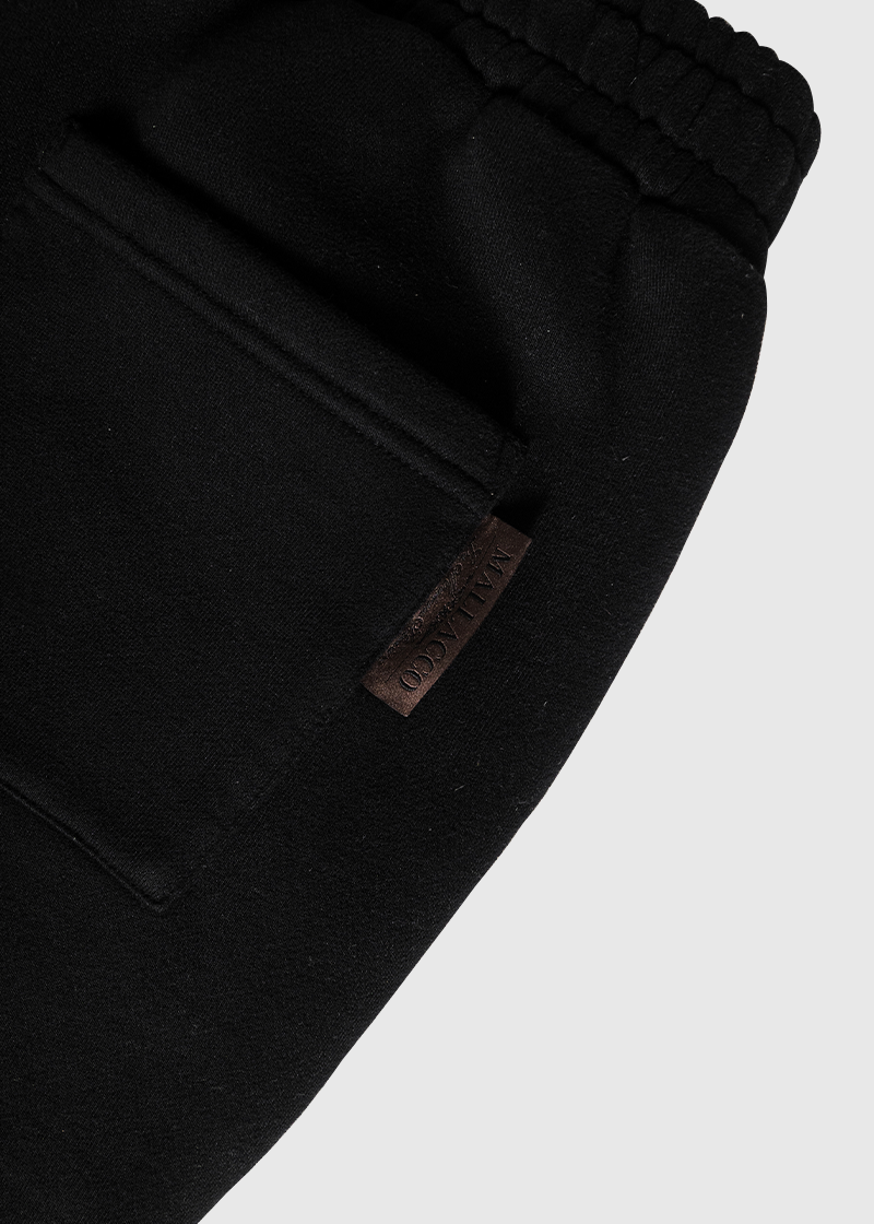 Close-up of Mallacco black jogger fabric and waistband detailing